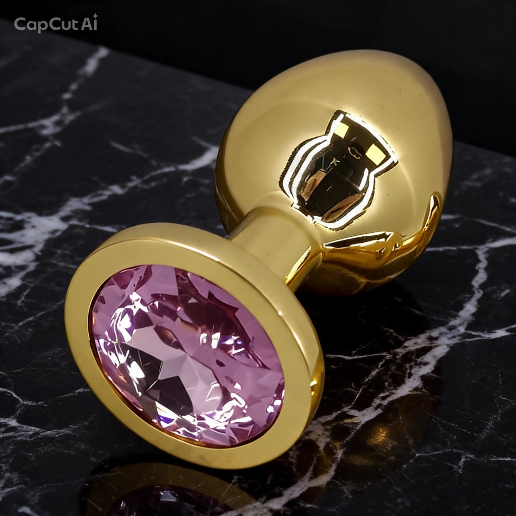 Plug anal de acero dorado con joya rosa - presentación elegante